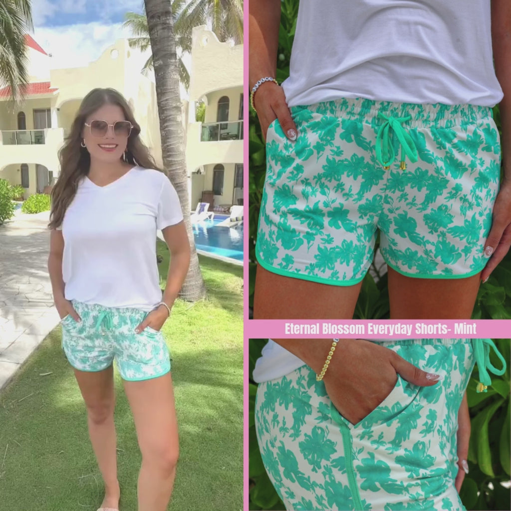 Mint floral printed mid-rise everyday shorts with a relaxed fit, drawstring waist, and side pockets, styled for casual spring and summer wear.