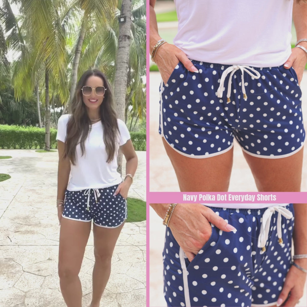 Navy polka dot printed mid-rise everyday shorts with a relaxed fit, drawstring tie waist, and side pockets, styled for casual spring and summer wear.