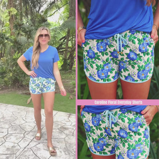 Blue floral printed mid-rise everyday shorts with a relaxed fit, drawstring tie waist, and side pockets, styled for casual spring and summer wear.
