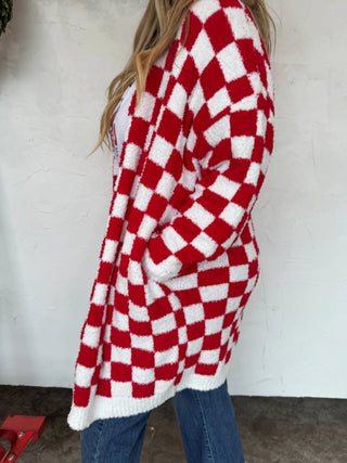 Barefoot Dreams–style red and white buffalo check cardigan, flattering mom-approved look.
