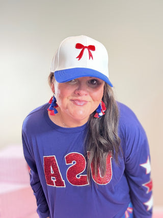 Red and Blue Bow Baseball Cap – Mila Bow Hat in bold red and blue featuring an embroidered bow and adjustable strap for a stylish, versatile look.