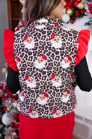 Holiday puffer vest featuring red and leopard pattern, layered over a cozy sweater.