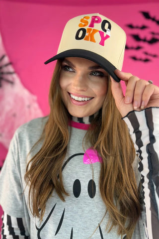 Cream canvas crown and black canvas bill snapback hat with “Spooky Vibes” Halloween embroidery; adjustable fit for festive fall style.